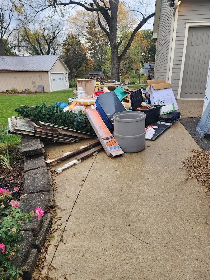 Dumpster being loaded with debris for Commercial Dumpster Rental in Needles